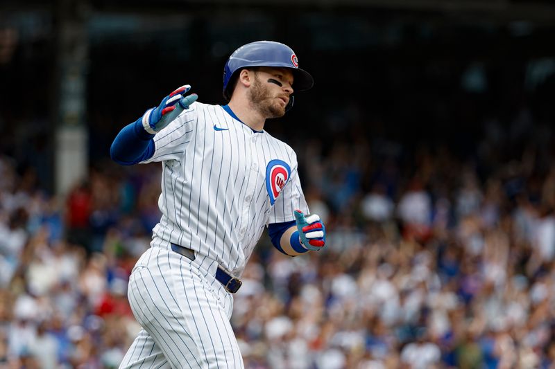 Jul 4, 2024; Chicago, Illinois, USA; Chicago Cubs outfielder Ian Happ (8) rounds the bases after hitting a three-run home run against the Philadelphia Phillies during the fourth inning at Wrigley Field. Mandatory Credit: Kamil Krzaczynski-USA TODAY Sports