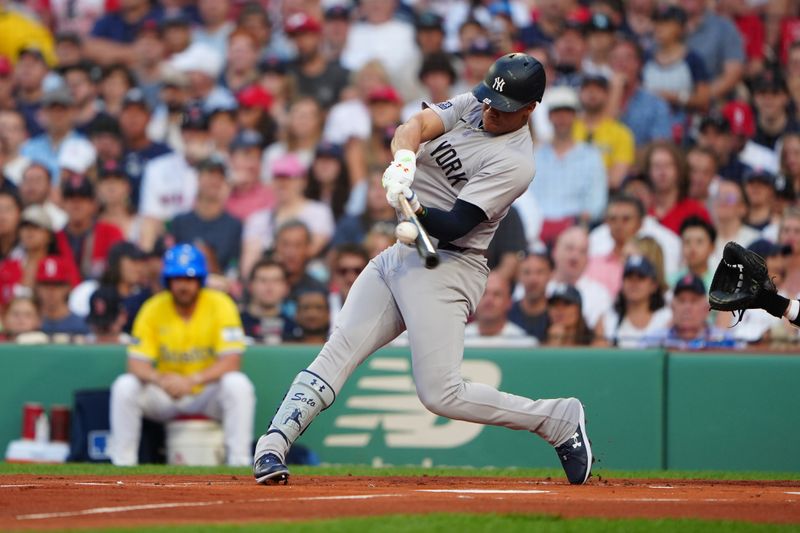 Jul 27, 2024; Boston, Massachusetts, USA; New York Yankees left fielder Juan Soto (22) hits a two-run home run against the Boston Red Sox during the first inning at Fenway Park. Mandatory Credit: Gregory Fisher-USA TODAY Sports