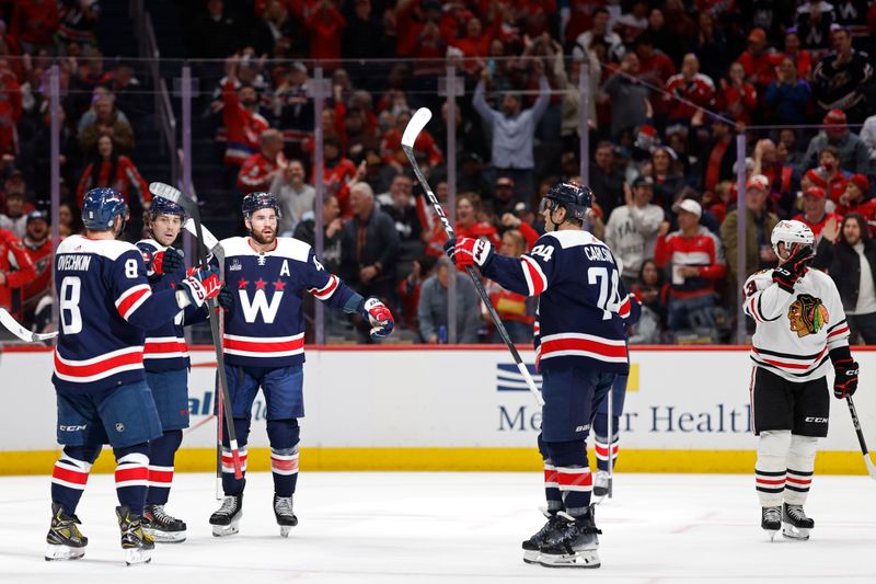 Mar 9, 2024; Washington, District of Columbia, USA; Washington Capitals right wing Tom Wilson (43) celebrates with teammates after scoring a goal against the Chicago Blackhawks in the first period at Capital One Arena. Mandatory Credit: Geoff Burke-USA TODAY Sports