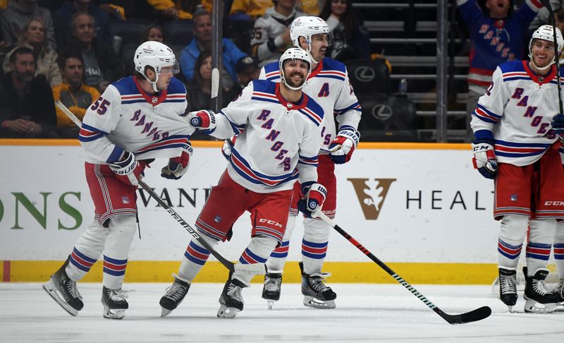 Dec 2, 2023; Nashville, Tennessee, USA; New York Rangers defenseman Ryan Lindgren (55) and center Vincent Trocheck (16) celebrate after a goal during the third period against the Nashville Predators at Bridgestone Arena. Mandatory Credit: Christopher Hanewinckel-USA TODAY Sports