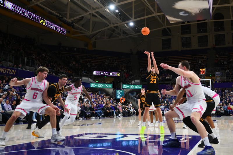 Feb 4, 2026; Seattle, Washington, USA; Iowa Hawkeyes guard Isaia Howard (23) shoots a free throw during the second half against the Washington Huskies at Alaska Airlines Arena at Hec Edmundson Pavilion. Mandatory Credit: Steven Bisig-Imagn Images