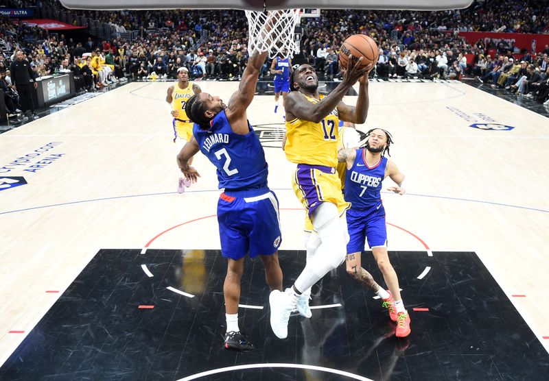 LOS ANGELES, CA - JANUARY 23:  Taurean Prince #12 of the Los Angeles Lakers goes to the basket during the game on January 23, 2024 at Crypto.Com Arena in Los Angeles, California. NOTE TO USER: User expressly acknowledges and agrees that, by downloading and/or using this Photograph, user is consenting to the terms and conditions of the Getty Images License Agreement. Mandatory Copyright Notice: Copyright 2024 NBAE (Photo by Juan Ocampo/NBAE via Getty Images)