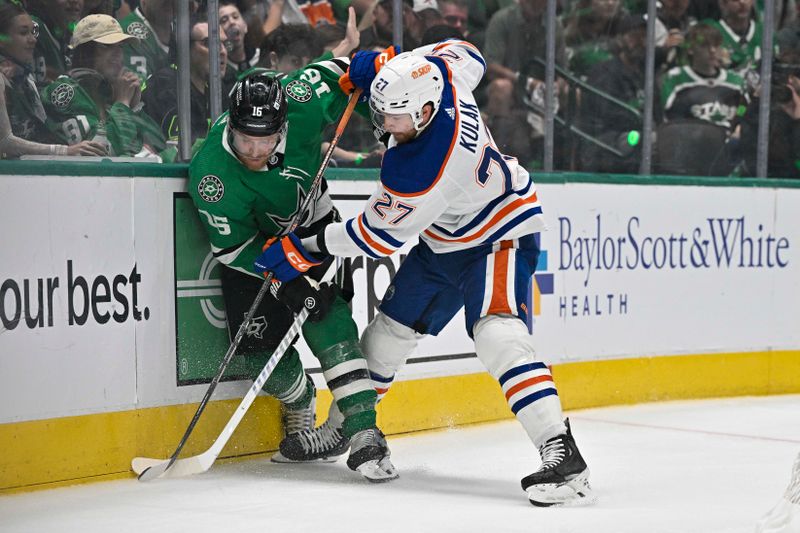 May 25, 2024; Dallas, Texas, USA; Dallas Stars center Joe Pavelski (16) and Edmonton Oilers defenseman Brett Kulak (27) battle for control of the puck during the second period in game two of the Western Conference Final of the 2024 Stanley Cup Playoffs at American Airlines Center. Mandatory Credit: Jerome Miron-USA TODAY Sports
