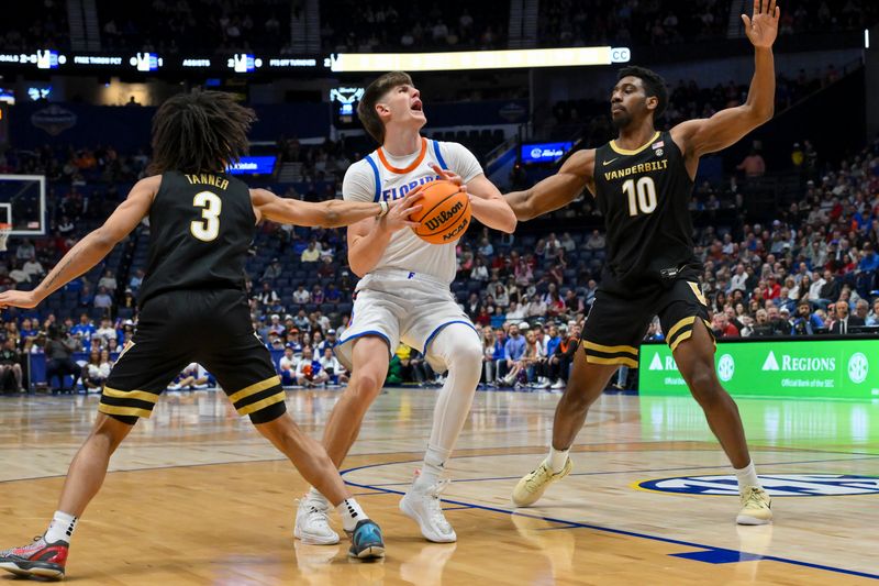 Mar 14, 2026; Nashville, TN, USA; Vanderbilt Commodores guard Tyler Tanner (3) fouls Florida Gators forward Alex Condon (21) during the first half at Bridgestone Arena. Mandatory Credit: Steve Roberts-Imagn Images Mar 14, 2026; Nashville, TN, USA; Vanderbilt Commodores guard Tyler Tanner (3) fouls Florida Gators forward Alex Condon (21) during the first half at Bridgestone Arena. Mandatory Credit: Steve Roberts-Imagn Images