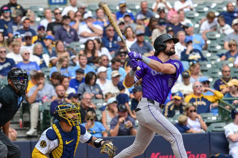 Sep 8, 2024; Milwaukee, Wisconsin, USA;  Colorado Rockies center fielder Sam Hilliard (16) hits a 3-run home run in the fifth inning as Milwaukee Brewers catcher Gary Sanchez (99) looks on at American Family Field. Mandatory Credit: Benny Sieu-Imagn Images