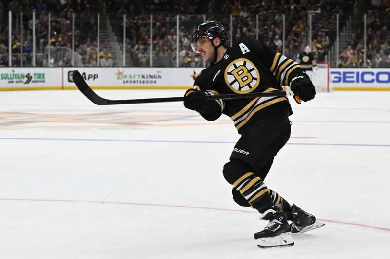 Nov 9, 2023; Boston, Massachusetts, USA; Boston Bruins right wing David Pastrnak (88) takes a shot against the New York Islanders during the third period at the TD Garden. Mandatory Credit: Brian Fluharty-USA TODAY Sports