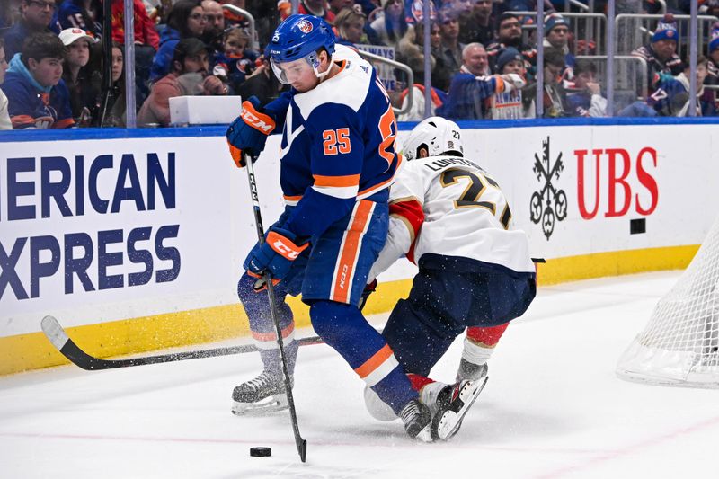 Jan 27, 2024; Elmont, New York, USA; Florida Panthers center Eetu Luostarinen (27) and New York Islanders defenseman Sebastian Aho (25) battle for the puck during the third period at UBS Arena. Mandatory Credit: Dennis Schneidler-USA TODAY Sports