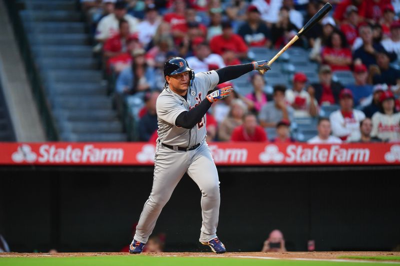 Sep 15, 2023; Anaheim, California, USA; Detroit Tigers designated hitter Miguel Cabrera (21) hits a single against the Los Angeles Angels during the first inning at Angel Stadium. Mandatory Credit: Gary A. Vasquez-USA TODAY Sports