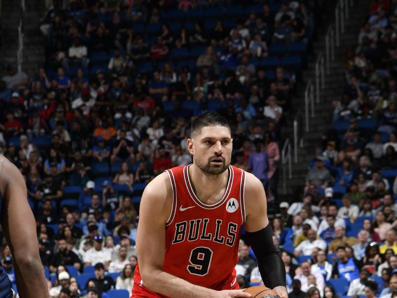 ORLANDO, FL - APRIL 7: Nikola Vucevic #9 of the Chicago Bulls looks on during the game against the Orlando Magic on April 7, 2024 at the Kia Center in Orlando, Florida. NOTE TO USER: User expressly acknowledges and agrees that, by downloading and or using this photograph, User is consenting to the terms and conditions of the Getty Images License Agreement. Mandatory Copyright Notice: Copyright 2024 NBAE (Photo by Fernando Medina/NBAE via Getty Images)