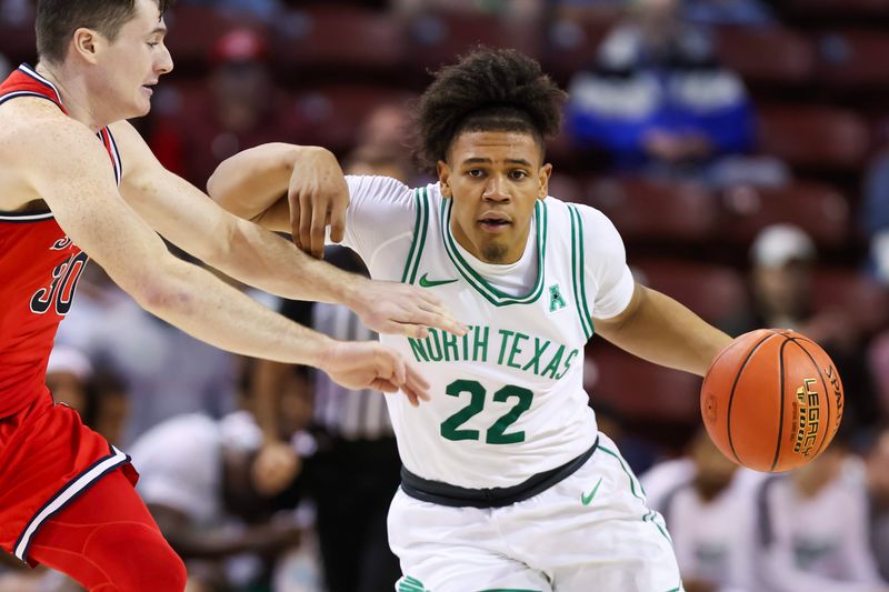 Nov 16, 2023; Charleston, South Carolina, USA; North Texas Mean Green guard CJ Noland (22) drives around St. John's Red Storm guard Sean Conway (30) in the first half at TD Arena. Mandatory Credit: David Yeazell-USA TODAY Sports