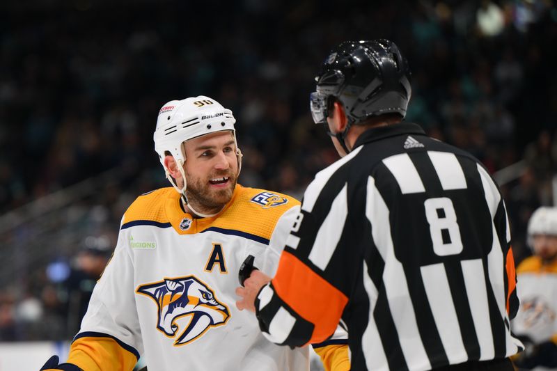 Mar 16, 2024; Seattle, Washington, USA; Nashville Predators center Ryan O'Reilly (90) and referee Francois St. Laurent (8) talk during the second period at Climate Pledge Arena. Mandatory Credit: Steven Bisig-USA TODAY Sports