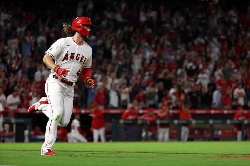 Sep 16, 2023; Anaheim, California, USA;  Los Angeles Angels center fielder Brett Phillips (4) hits a solo home run during the ninth inning against the Detroit Tigers at Angel Stadium. Mandatory Credit: Kiyoshi Mio-USA TODAY Sports