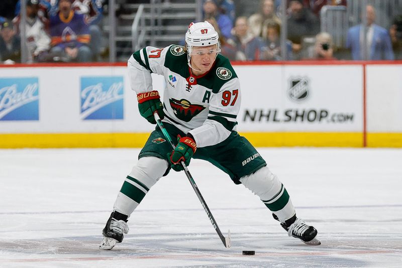 Mar 8, 2024; Denver, Colorado, USA; Minnesota Wild left wing Kirill Kaprizov (97) controls the puck in the first period against the Colorado Avalanche at Ball Arena. Mandatory Credit: Isaiah J. Downing-USA TODAY Sports