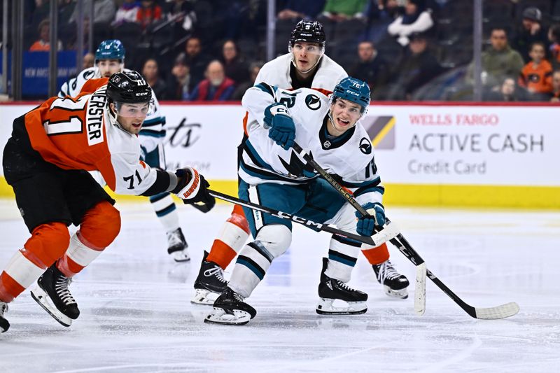 Mar 12, 2024; Philadelphia, Pennsylvania, USA; San Jose Sharks left wing William Eklund (72) skates between Philadelphia Flyers right wing Tyson Foerster (71) and defenseman Egor Zamula (5) in the second period at Wells Fargo Center. Mandatory Credit: Kyle Ross-USA TODAY Sports