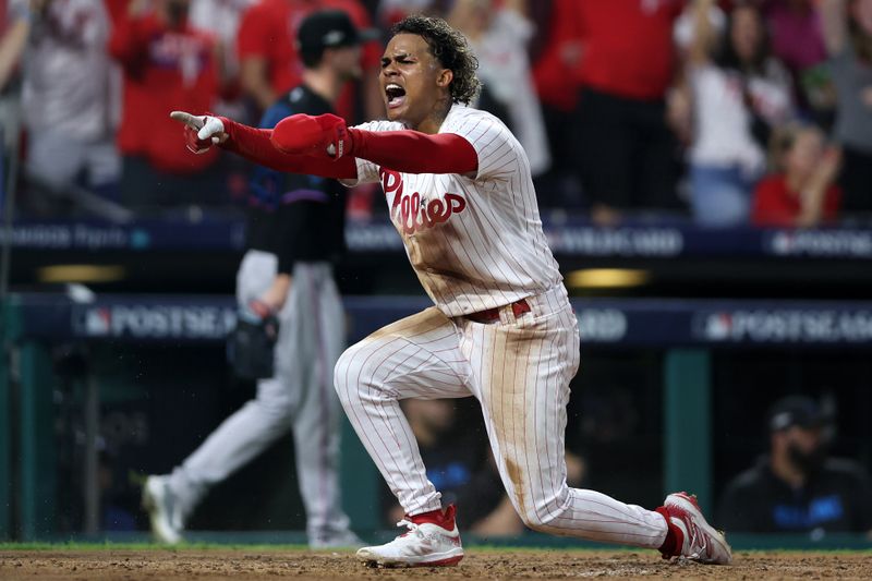 Oct 4, 2023; Philadelphia, Pennsylvania, USA; Philadelphia Phillies left fielder Cristian Pache (19) reacts after scoring a run against the Miami Marlins during the third inning for game two of the Wildcard series for the 2023 MLB playoffs at Citizens Bank Park. Mandatory Credit: Bill Streicher-USA TODAY Sports