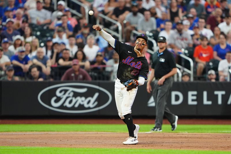 Jul 25, 2024; New York City, New York, USA; New York Mets third baseman Mark Vientos (27) throws out Atlanta Braves catcher Travis d'Arnaud (not pictured) after fielding a ground ball during the third inning at Citi Field. Mandatory Credit: Gregory Fisher-USA TODAY Sports