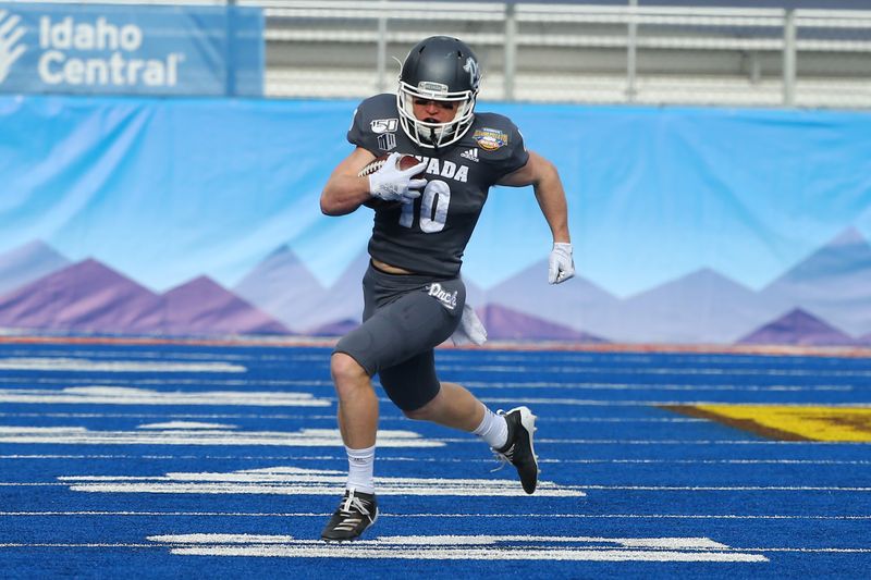 Jan 3, 2020; Boise, Idaho, USA; Nevada Wolf Pack wide receiver Ben Putman (10) runs after a catch  during the first half of the Famous Idaho Potato Bowl against the Ohio Bobcats  at Albertsons Stadium. Mandatory Credit: Brian Losness-USA TODAY Sports

