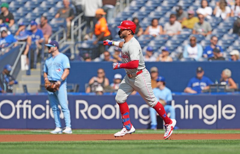 Sep 4, 2024; Toronto, Ontario, CAN; Philadelphia Phillies left fielder Kyle Schwarber (12) runs the bases after hitting home run against the Toronto Blue Jays during the first inning at Rogers Centre. Mandatory Credit: Nick Turchiaro-Imagn Images