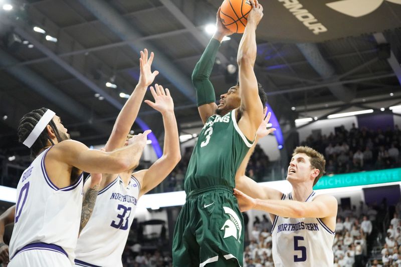 Jan 7, 2024; Evanston, Illinois, USA; Northwestern Wildcats guard Ryan Langborg (5) defends Michigan State Spartans guard Jaden Akins (3) during the first half at Welsh-Ryan Arena. Mandatory Credit: David Banks-USA TODAY Sports