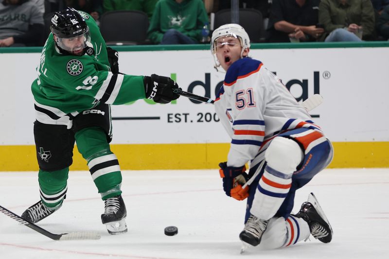 Oct 19, 2024; Dallas, Texas, USA; Dallas Stars center Colin Blackwell (15) shoots the puck against Edmonton Oilers defenseman Troy Stecher (51) in the third period at American Airlines Center. Mandatory Credit: Tim Heitman-Imagn Images