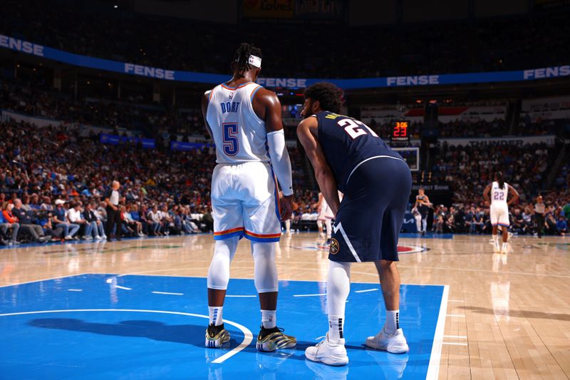 OKLAHOMA CITY, OK - MARCH 10: Jamal Murray #27 of the Denver Nuggets and Luguentz Dort #5 of the Oklahoma City Thunder look on during the game on March 10, 2025 at Paycom Center in Oklahoma City, Oklahoma. NOTE TO USER: User expressly acknowledges and agrees that, by downloading and or using this photograph, User is consenting to the terms and conditions of the Getty Images License Agreement. Mandatory Copyright Notice: Copyright 2025 NBAE(Photo by Zach Beeker/NBAE via Getty Images)