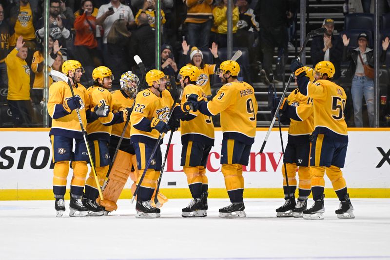 Oct 21, 2023; Nashville, Tennessee, USA;  Nashville Predators goaltender Juuse Saros (74) celebrates the win with his teammates \S| during the third period at Bridgestone Arena. Mandatory Credit: Steve Roberts-USA TODAY Sports