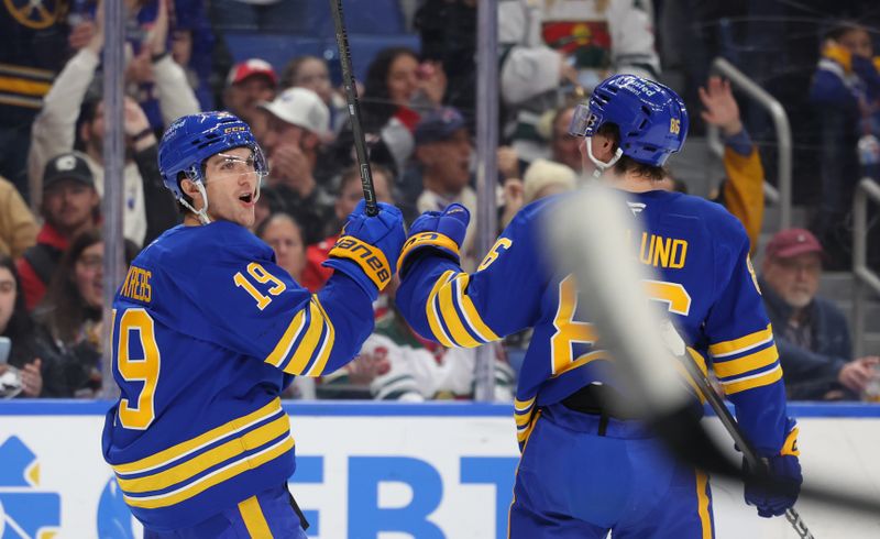 Jan 17, 2026; Buffalo, New York, USA;  Buffalo Sabres center Peyton Krebs (19) reacts after scoring a goal during the second period against the Minnesota Wild at KeyBank Center. Mandatory Credit: Timothy T. Ludwig-Imagn Images