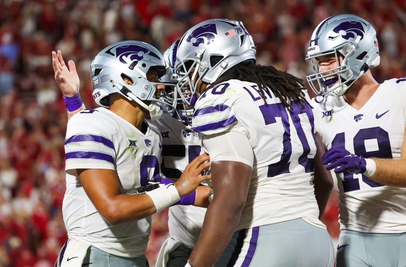 Sep 24, 2022; Norman, Oklahoma, USA;  Kansas State Wildcats quarterback Adrian Martinez (9) celebrates with teammates after scoring a touchdown during the fourth quarter against the Oklahoma Sooners at Gaylord Family-Oklahoma Memorial Stadium. Mandatory Credit: Kevin Jairaj-USA TODAY Sports