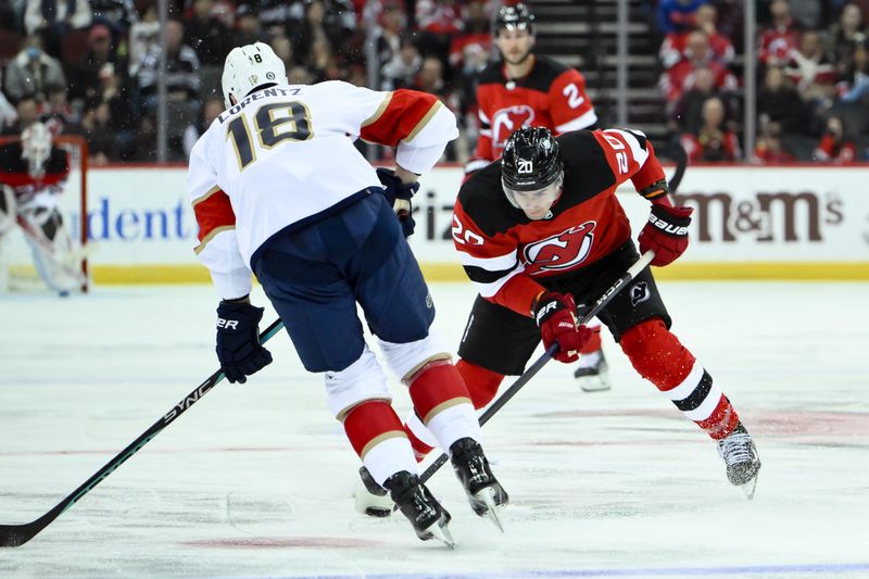 Oct 16, 2023; Newark, New Jersey, USA; New Jersey Devils center Michael McLeod (20) tries to skate past Florida Panthers center Steven Lorentz (18) during the second period at Prudential Center. Mandatory Credit: John Jones-USA TODAY Sports