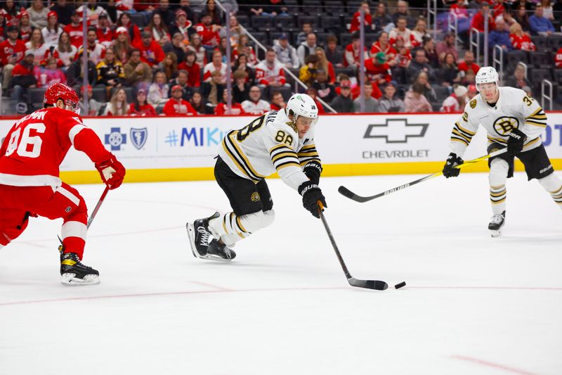 Dec 31, 2023; Detroit, Michigan, USA; Boston Bruins right wing David Pastrnak (88) handles the puck during the first period of the game between the Boston Bruins and the Detroit Red Wings at Little Caesars Arena. Mandatory Credit: Brian Bradshaw Sevald-USA TODAY Sports