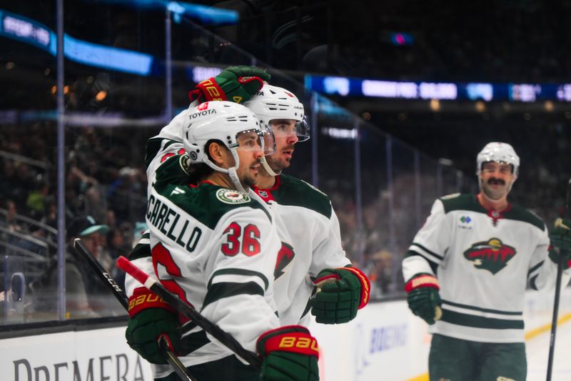 Mar 4, 2025; Seattle, Washington, USA; Minnesota Wild right wing Mats Zuccarello (36) and left wing Marcus Johansson (90) celebrate after Zuccarello scored a goal against the Seattle Kraken during the second period at Climate Pledge Arena. Mandatory Credit: Steven Bisig-Imagn Images