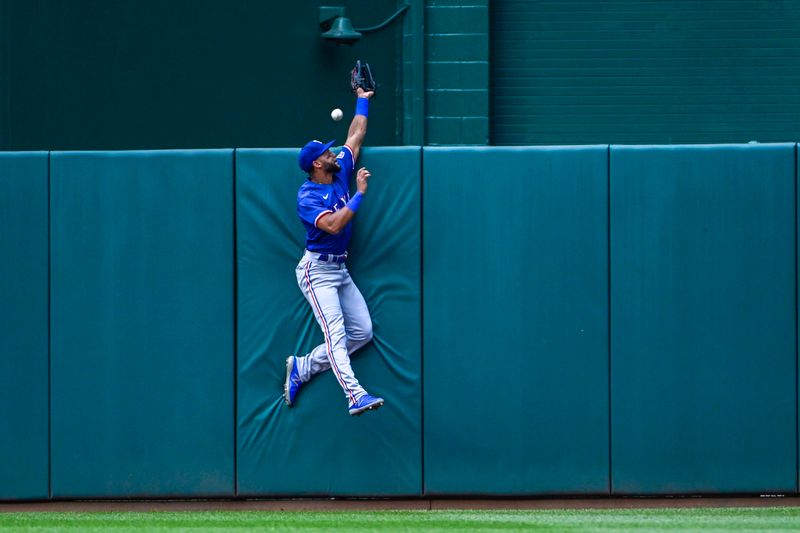 Jul 8, 2023; Washington, District of Columbia, USA; Texas Rangers center fielder Leody Taveras (3) is unable to catch the two run home run hit by Washington Nationals center fielder Alex Call (not shown) during the second inning at Nationals Park. Mandatory Credit: Brad Mills-USA TODAY Sports