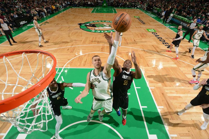 BOSTON, MA - FEBRUARY 4: Kristaps Porzingis #8 of the Boston Celtics drives to the basket during the game  against the Memphis Grizzlies  on February 4, 2024 at the TD Garden in Boston, Massachusetts. NOTE TO USER: User expressly acknowledges and agrees that, by downloading and or using this photograph, User is consenting to the terms and conditions of the Getty Images License Agreement. Mandatory Copyright Notice: Copyright 2024 NBAE  (Photo by Brian Babineau/NBAE via Getty Images)