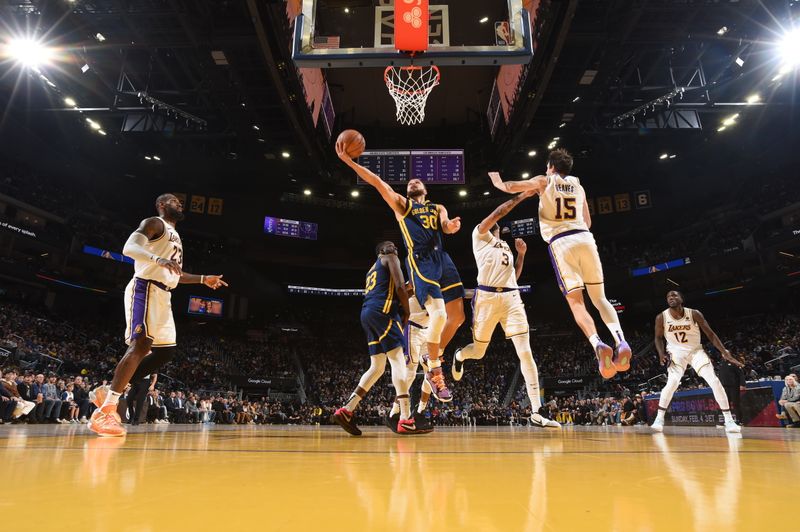 SAN FRANCISCO, CA - JANUARY 27: Stephen Curry #30 of the Golden State Warriors shoots the ball during the game against the Los Angeles Lakers on January 27, 2024 at Chase Center in San Francisco, California. NOTE TO USER: User expressly acknowledges and agrees that, by downloading and or using this photograph, user is consenting to the terms and conditions of Getty Images License Agreement. Mandatory Copyright Notice: Copyright 2024 NBAE (Photo by Noah Graham/NBAE via Getty Images)