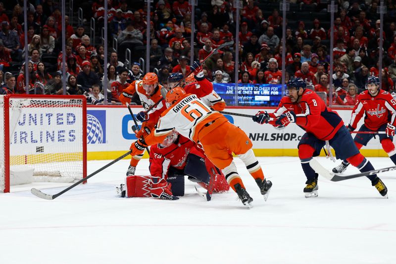 Jan 5, 2026; Washington, District of Columbia, USA; Anaheim Ducks left wing Cutter Gauthier (61) attempts a shot on Washington Capitals goaltender Charlie Lindgren (79) as Capitals left wing Alex Ovechkin (8) defends during the second period at Capital One Arena. Mandatory Credit: Geoff Burke-Imagn Images