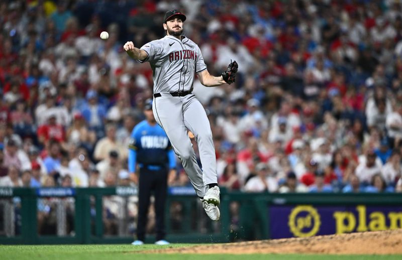 Jun 21, 2024; Philadelphia, Pennsylvania, USA; Arizona Diamondbacks relief pitcher Ryan Thompson (81) throws to first against the Philadelphia Phillies in the eighth inning at Citizens Bank Park. Mandatory Credit: Kyle Ross-USA TODAY Sports