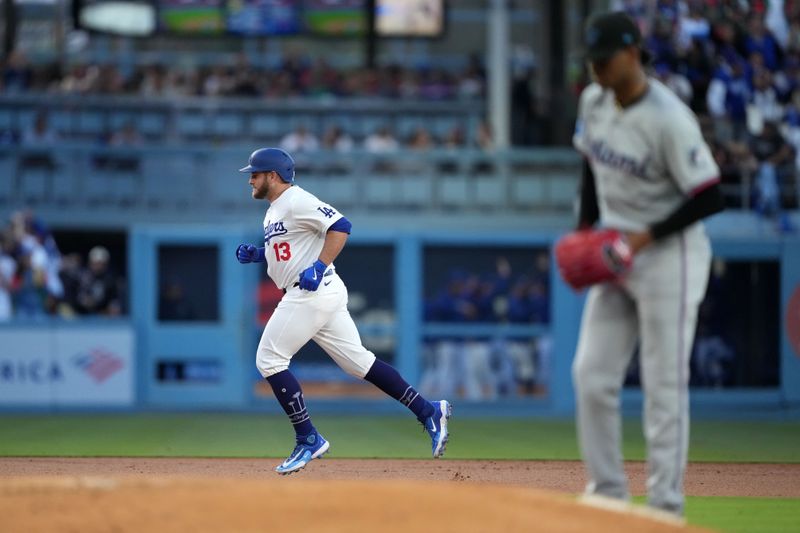 May 7, 2024; Los Angeles, California, USA; Los Angeles Dodgers third baseman Max Muncy (13) runs the bases after hitting a grand slam in the first inning against Miami Marlins pitcher Edward Cabrera (27) at Dodger Stadium. Mandatory Credit: Kirby Lee-USA TODAY Sports