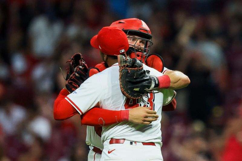 May 21, 2024; Cincinnati, Ohio, USA; Cincinnati Reds catcher Tyler Stephenson (37) hugs relief pitcher Alexis Diaz (43) after the victory over the San Diego Padres at Great American Ball Park. Mandatory Credit: Katie Stratman-USA TODAY Sports