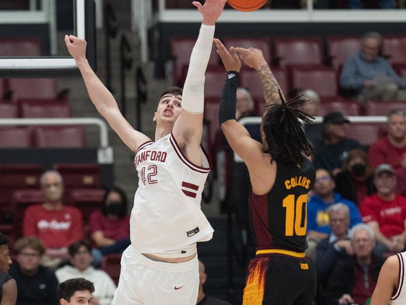 Feb 9, 2023; Stanford, California, USA;  Stanford Cardinal forward Maxime Raynaud (42) defends against Arizona State Sun Devils guard Frankie Collins (10) during the first half at Maples Pavilion. Mandatory Credit: Stan Szeto-USA TODAY Sports