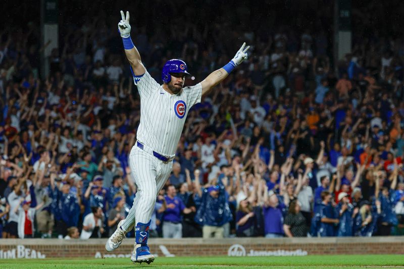 Aug 1, 2024; Chicago, Illinois, USA; Chicago Cubs outfielder Mike Tauchman (40) celebrates his walk-off single against the St. Louis Cardinals during the ninth inning at Wrigley Field. Mandatory Credit: Kamil Krzaczynski-USA TODAY Sports