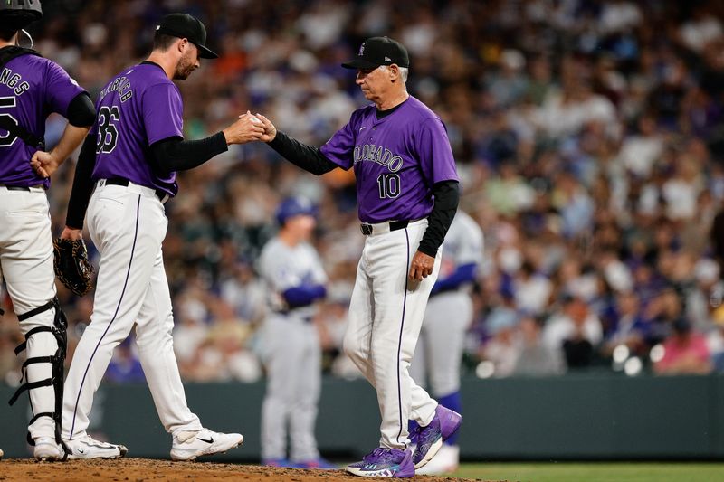 Jun 17, 2024; Denver, Colorado, USA; Colorado Rockies pitcher Geoff Hartlieb (36) is pulled by manager Bud Black (10) in the eighth inning against the Los Angeles Dodgers at Coors Field. Mandatory Credit: Isaiah J. Downing-USA TODAY Sports