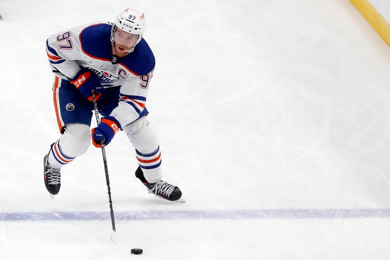 Mar 10, 2024; Pittsburgh, Pennsylvania, USA;  Edmonton Oilers center Connor McDavid (97) skates with the puck against the Pittsburgh Penguins during the third period at PPG Paints Arena. The Oilers won 4-0. Mandatory Credit: Charles LeClaire-USA TODAY Sports