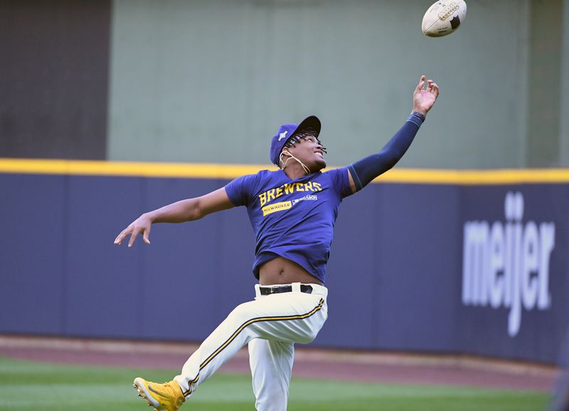 Oct 3, 2023; Milwaukee, Wisconsin, USA; Milwaukee Brewers relief pitcher Abner Uribe (45) warms up playing catch before their game against the Arizona Diamondbacks during game one of the Wildcard series for the 2023 MLB playoffs at American Family Field. Mandatory Credit: Michael McLoone-USA TODAY Sports