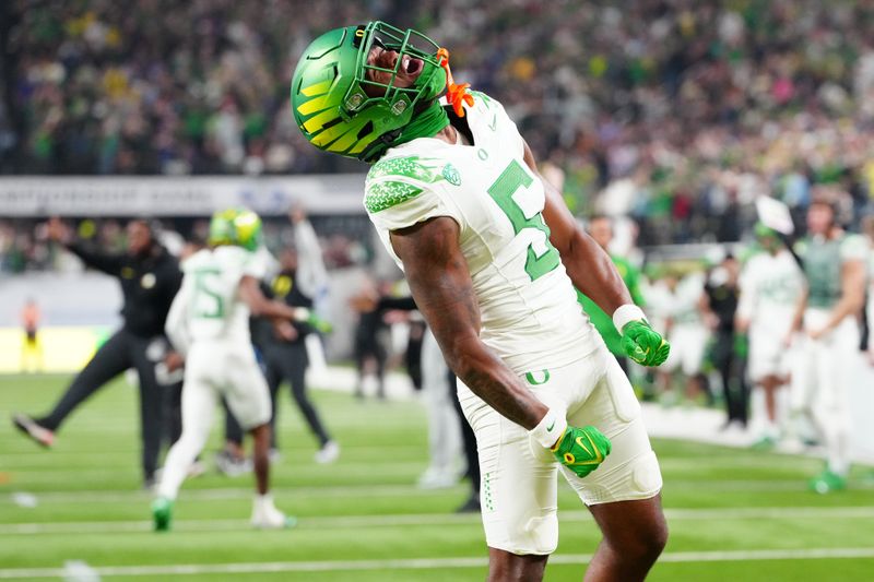 Dec 1, 2023; Las Vegas, NV, USA; Oregon Ducks wide receiver Traeshon Holden (5) reacts after a play against the Washington Huskies during the third quarter at Allegiant Stadium. Mandatory Credit: Stephen R. Sylvanie-USA TODAY Sports