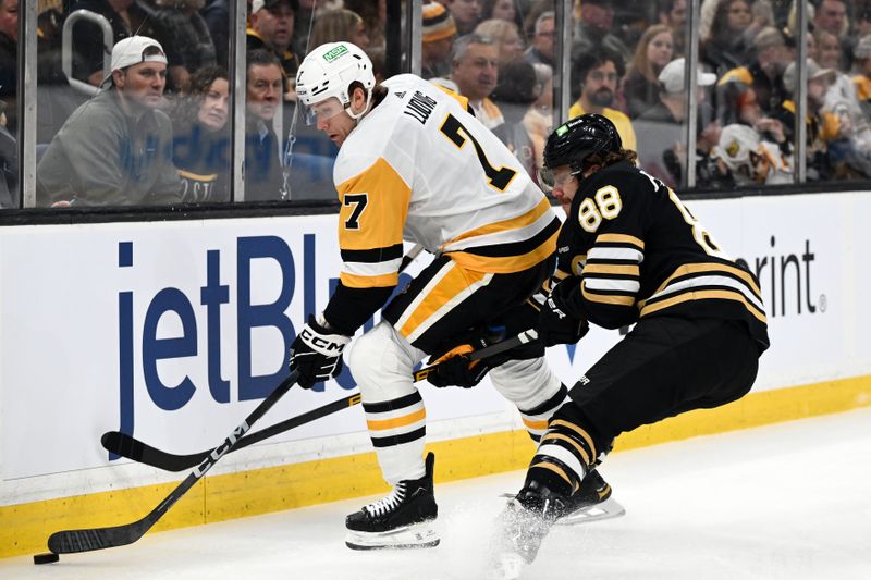 Mar 9, 2024; Boston, Massachusetts, USA; Pittsburgh Penguins defenseman John Ludvig (7) controls the puck against Boston Bruins right wing David Pastrnak (88) during the first period at the TD Garden. Mandatory Credit: Brian Fluharty-USA TODAY Sports