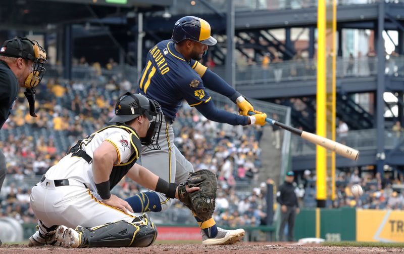 May 24, 2025; Pittsburgh, Pennsylvania, USA;  Milwaukee Brewers center fielder Jackson Chourio (11) hits a single against the Pittsburgh Pirates during the sixth inning at PNC Park. Mandatory Credit: Charles LeClaire-Imagn Images