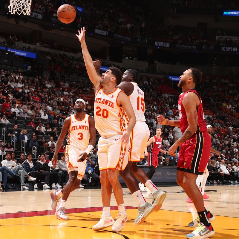 MIAMI, FL - FEBRUARY 26: Georges Niang #20 of the Atlanta Hawks shoots the ball during the game against the Miami Heat on February 26, 2025 at Kaseya Center in Miami, Florida. NOTE TO USER: User expressly acknowledges and agrees that, by downloading and or using this Photograph, user is consenting to the terms and conditions of the Getty Images License Agreement. Mandatory Copyright Notice: Copyright 2025 NBAE (Photo by Issac Baldizon/NBAE via Getty Images)