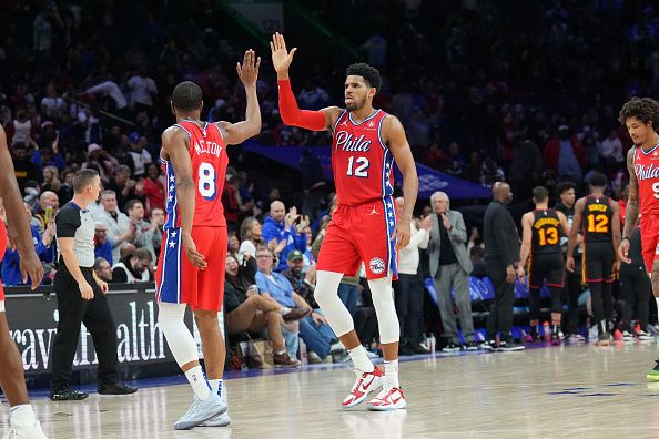 PHILADELPHIA, PA - DECEMBER 8: Tobias Harris #12 and De'Anthony Melton #8 of the Philadelphia 76ers high fives during the game against the Atlanta Hawks on December 8, 2023 at the Wells Fargo Center in Philadelphia, Pennsylvania NOTE TO USER: User expressly acknowledges and agrees that, by downloading and/or using this Photograph, user is consenting to the terms and conditions of the Getty Images License Agreement. Mandatory Copyright Notice: Copyright 2023 NBAE (Photo by Jesse D. Garrabrant/NBAE via Getty Images)