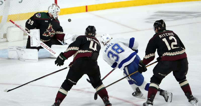 Feb 15, 2023; Tempe, Arizona, USA; Tampa Bay Lightning left wing Brandon Hagel (38) shoots against Arizona Coyotes goaltender Connor Ingram (39) during the third period at Mullett Arena. Mandatory Credit: Joe Camporeale-USA TODAY Sports