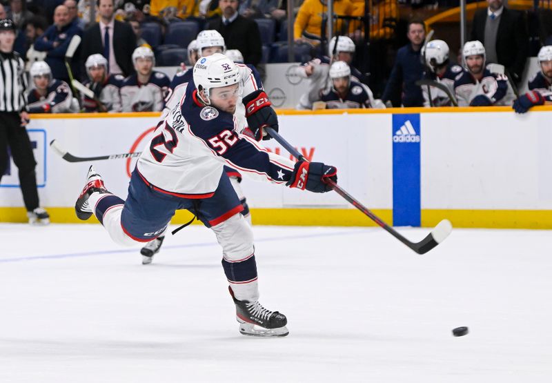 Jan 17, 2023; Nashville, Tennessee, USA;  Columbus Blue Jackets right wing Emil Bemstrom (52) takes a shot on goal against the Nashville Predators during the second period at Bridgestone Arena. Mandatory Credit: Steve Roberts-USA TODAY Sports